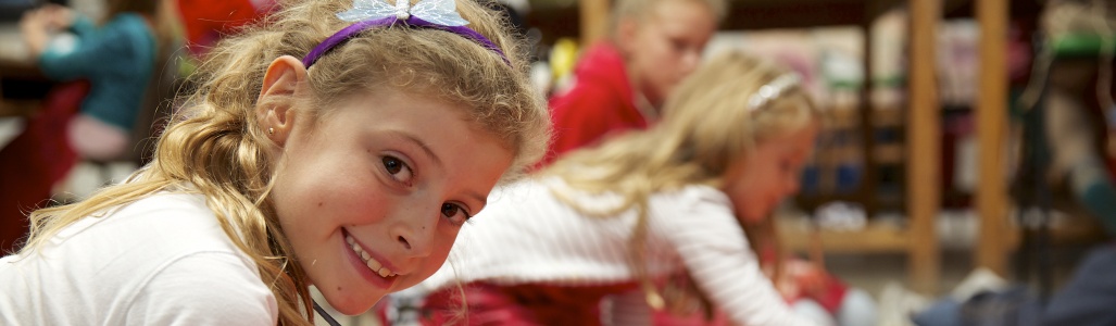 Young girl takes part in large group painting