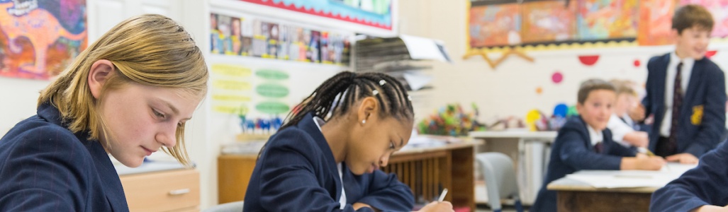 Students drawing in school art room