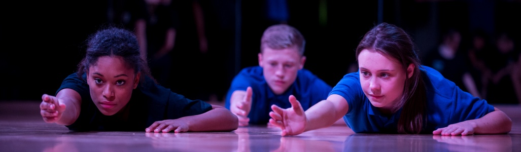 Young people taking part in a dance performance
